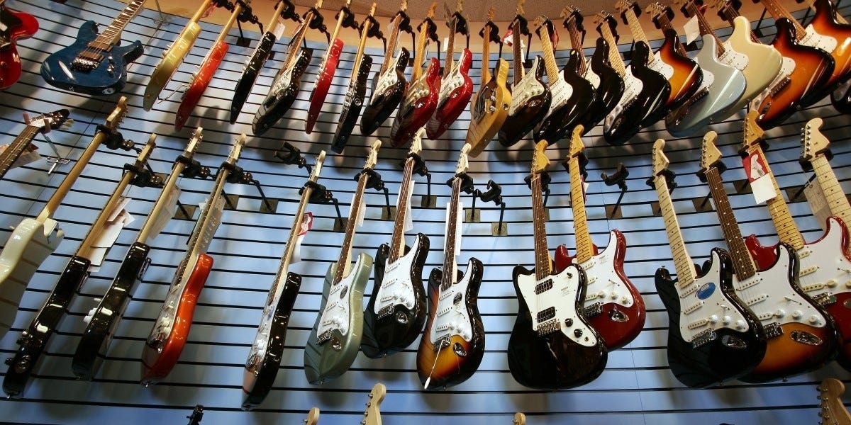 Wall of guitars for sale