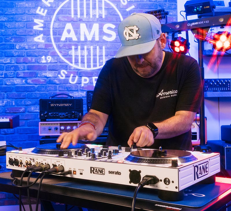 Pioneer DJ controller with dual jog wheels, mixer section, and performance pads.
