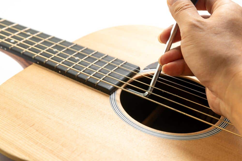 Truss rod adjustment on a guitar