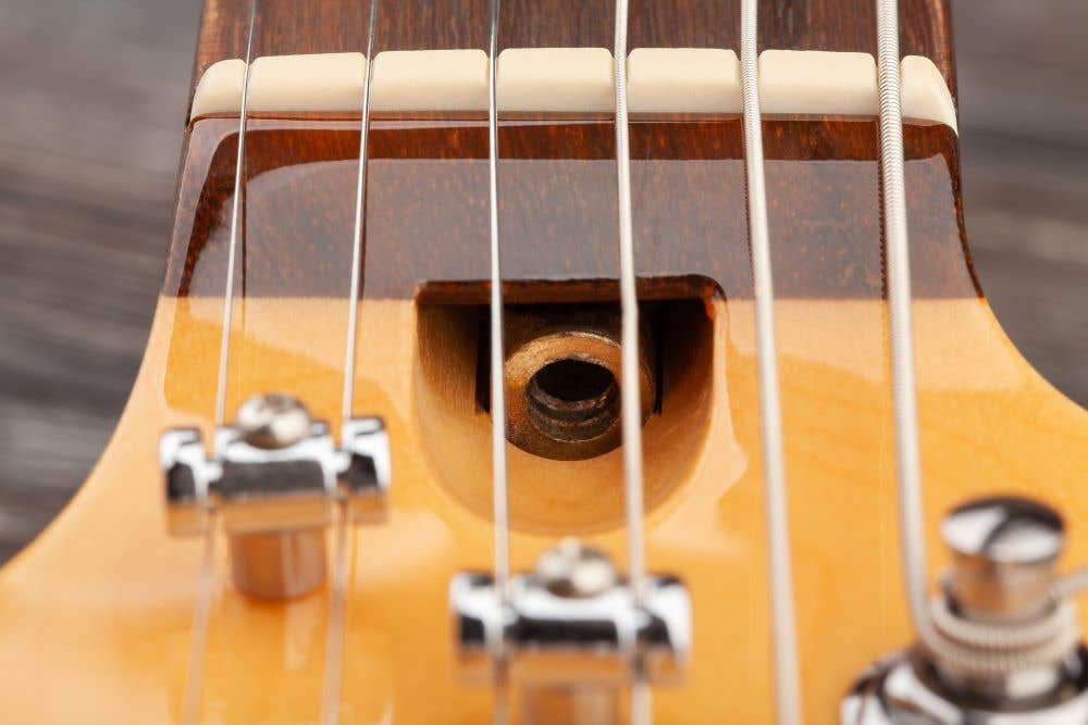 Closeup of guitar truss rod adjustment