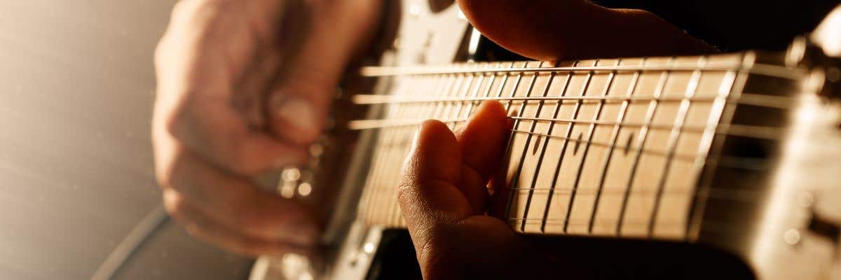 guitarist bending string with best scale length