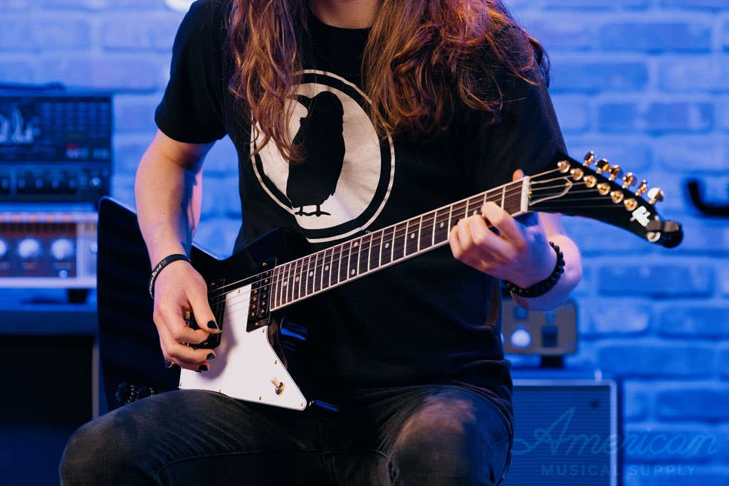 Guitarist playing a Gibson Explorer.