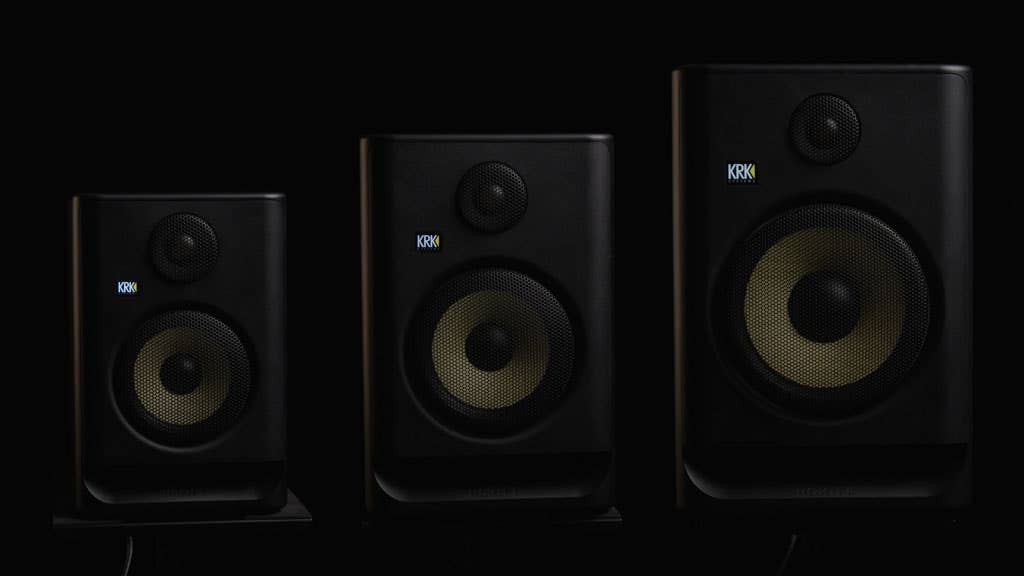 Three KRK studio monitors side by side