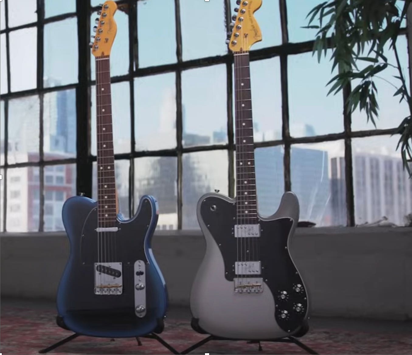 blue fender stratocaster and white fender stratocaster side by side