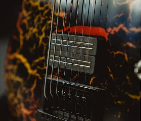 Close-up of a pickup on a Jackson 7-string guitar