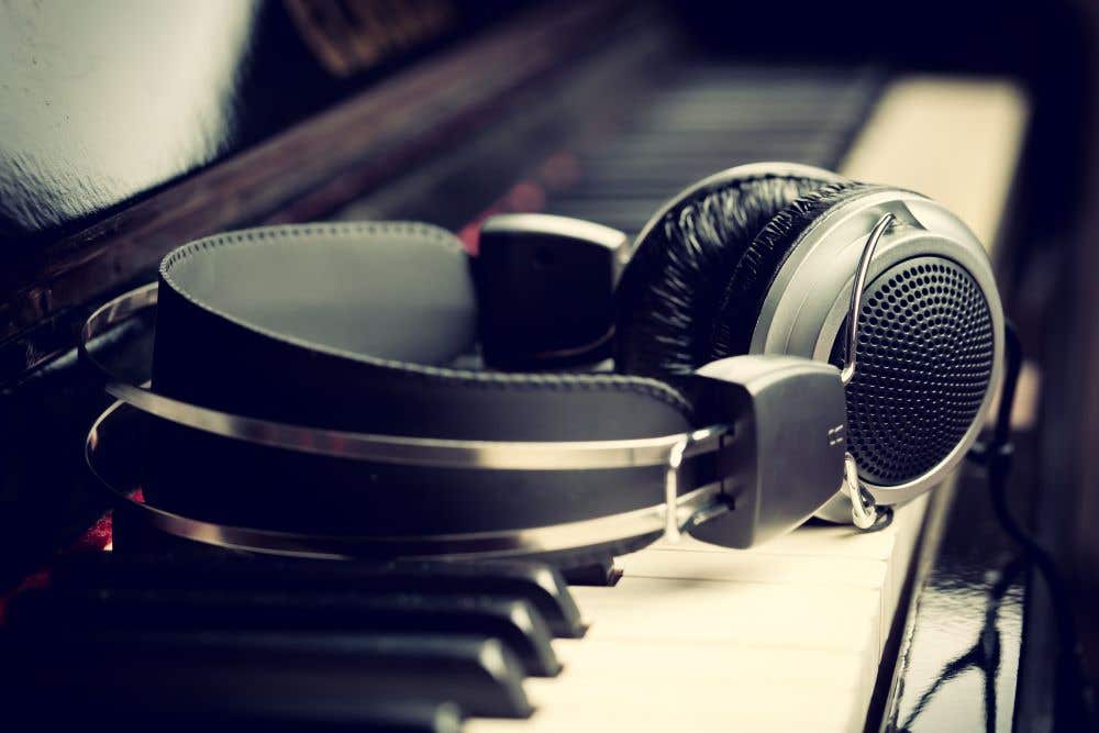 Open-back headphones on a piano